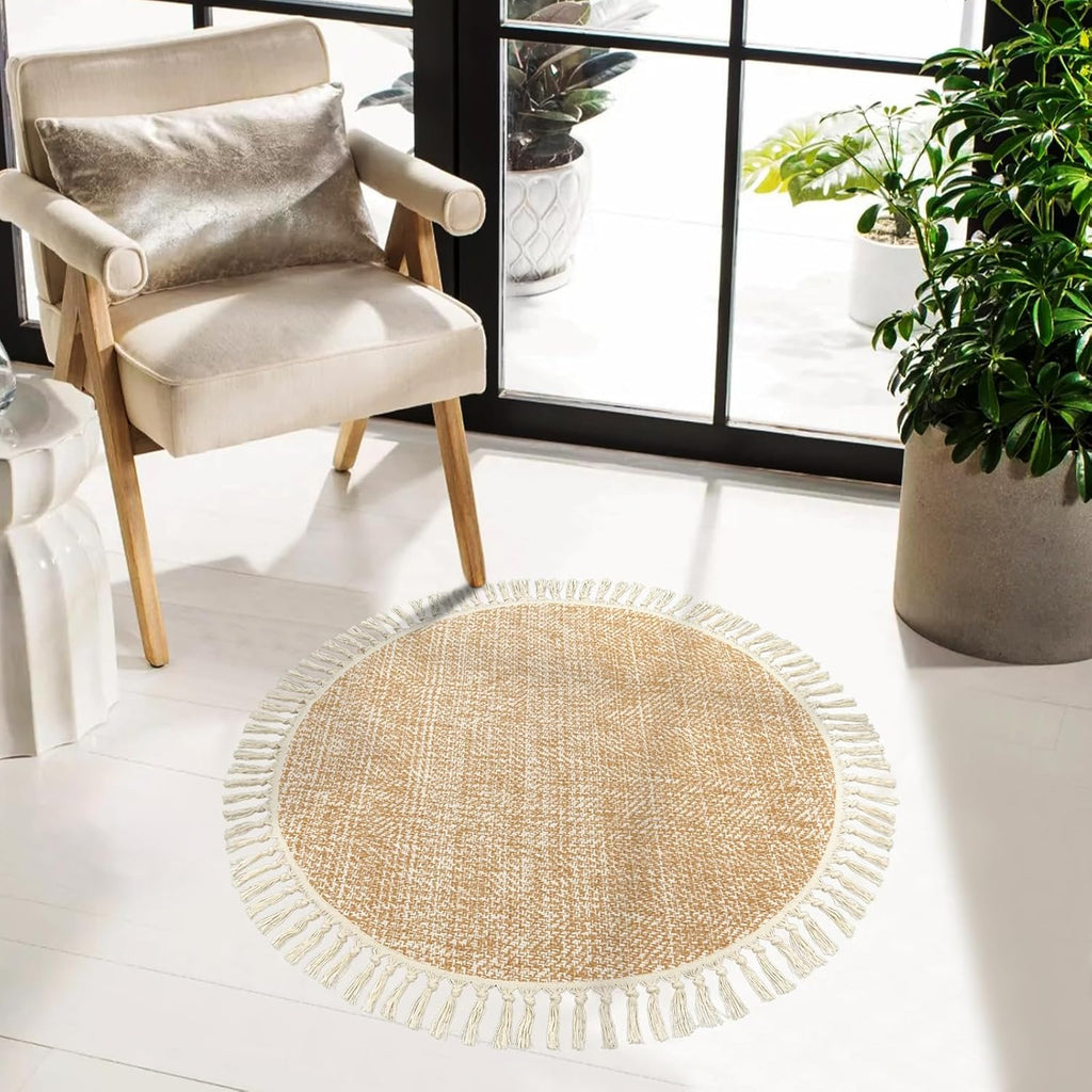 Hand-Woven Round Rug—Crafted from soft cotton and machine-washable (3 ft). Featuring decorative tassels and a beige/cream color palette, this farmhouse-style rug adds a warm and cozy touch to bedrooms, living rooms, dining areas, desks, and office spaces.