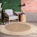 6'7" Round Outdoor Rug — Casual design style with striped trim; stain-resistant and durable; suitable for patios, balconies, bedrooms, living rooms, dining rooms, and bathrooms; Light Brown