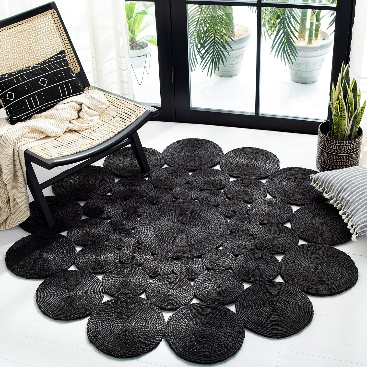 Round Rug — 4-foot round design in a black tone. Hand-woven to capture the rustic charm of farmhouse country style. Perfectly suited for placement in high-traffic areas such as living rooms and bedrooms.